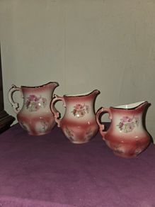 Matching Rockingham Staffordshire pottery pitchers