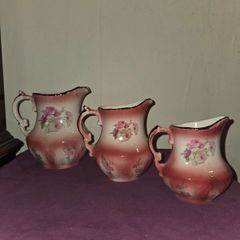 Matching Rockingham Staffordshire pottery pitchers