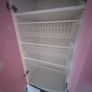 Pink and white children's wardrobe with internal wire baskets Image 2