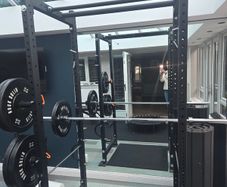 Mint condition - amazing heavy duty black squat rack with almost brand new Rock Solid barbell and bumper plates - a must see!!!