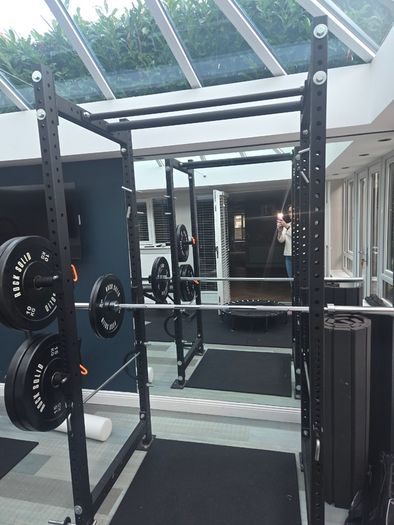 Mint condition - amazing heavy duty black squat rack with almost brand new Rock Solid barbell and bumper plates - a must see!!!