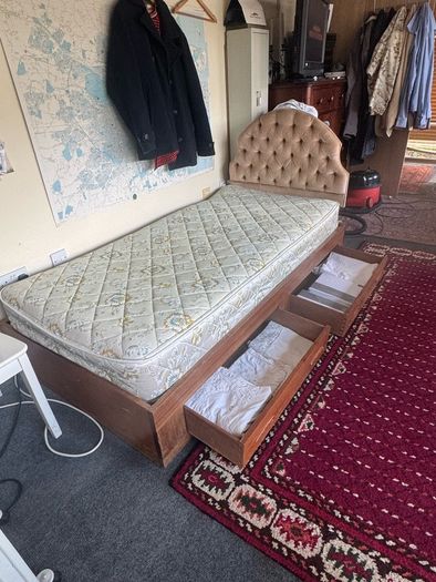 Wooden single bed with drawers