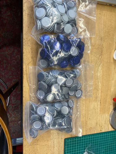 Homebrew beer bottles with crates and caps
