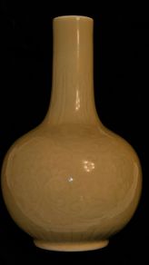 Chinese imperial yellow ceramic vase with incised lotus flower motif