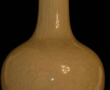 Chinese imperial yellow ceramic vase with incised lotus flower motif