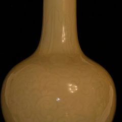 Chinese imperial yellow ceramic vase with incised lotus flower motif