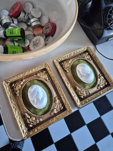 A pair of MidCentury Kelgin wall hanging Plaster  Vintage decorative pair of wall plaques featuring plaster cameos on green velvet background with ornate gold relief plaster frames