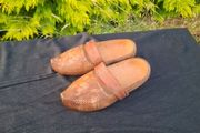Psir of sculpted wood clogs postage possible