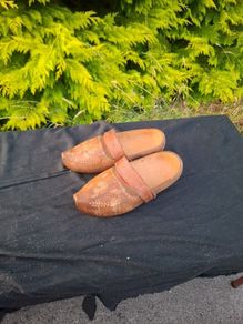 Psir of sculpted wood clogs postage possible