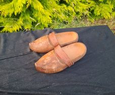 Psir of sculpted wood clogs postage possible
