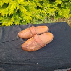 Psir of sculpted wood clogs postage possible
