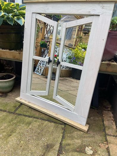 Garden reflection mirror window