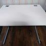 Modern white office desk with grey metal frame Image 5