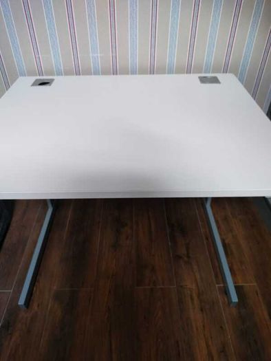 Modern white office desk with grey metal frame