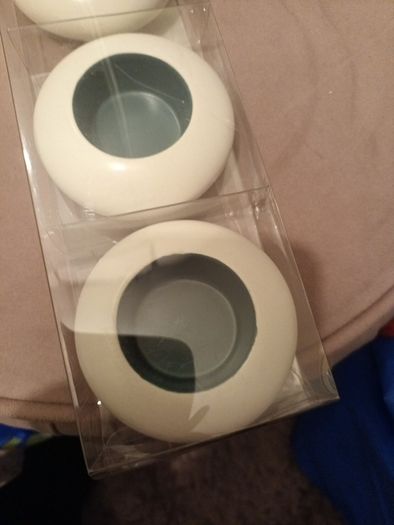 Four ceramic T light holders
