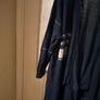 long-sleeved navy garment is an oversized graphic Jacket cardigan. Image 3
