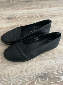 Flat slip on black women's casual shoes