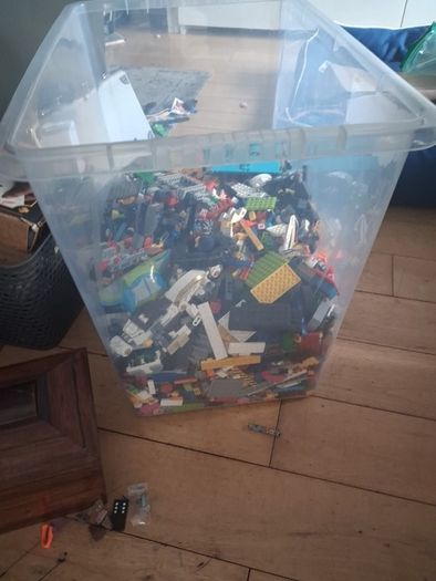 Big box of lego with mini figurines open to offers