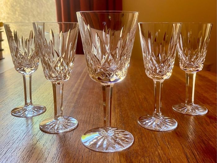 Four Waterford Crystal Lismore Sherry Glasses, One Lismore Small Wine Glass, 1970s.