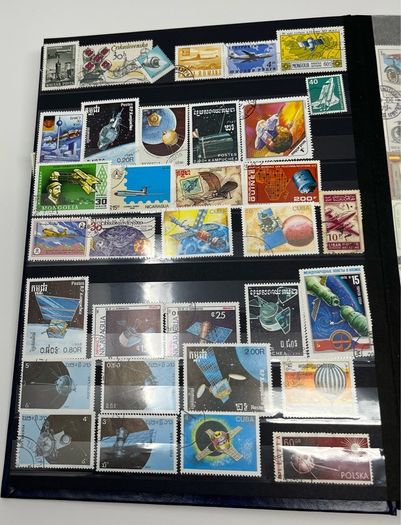 Ace Black 32 page/ 16 leaf Stamp Album with over 900 stamps. Thematic of Animals, Plants, Classic Cars, Space, Trains, Sport & Disney noted.