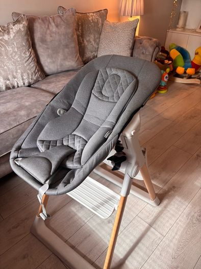 Mash high chair with changeable baby seat.