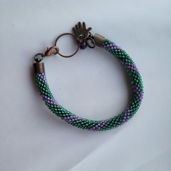 Handmade beaded rope and copper bracelet. purple and green