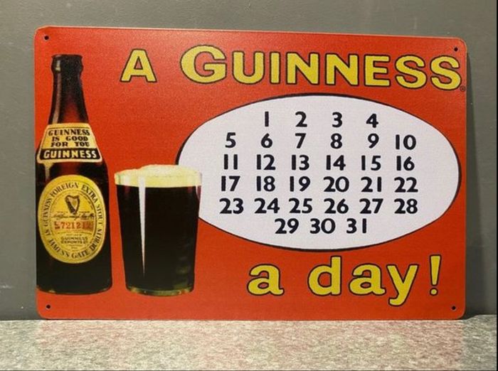 A Guinness A Day Tin Metal sign