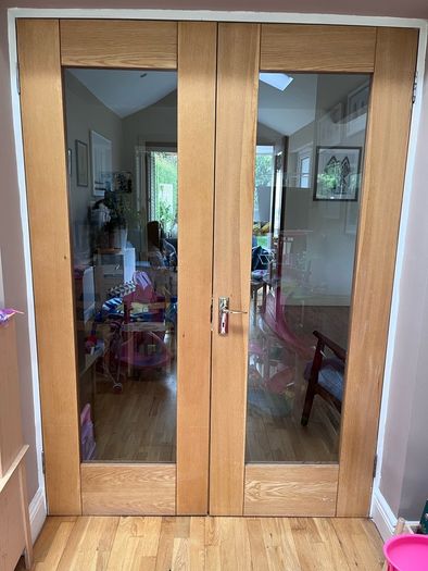 Solid wood internal double doors with clear glass panels