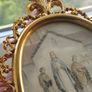An antique-style painting set in an ornate, gold-toned frame. Image 7
