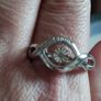 A 925 sterling silver ring with a floating diamond centerpiece. Image 2