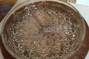 Nut dish in the holder is plastic have wood finished.