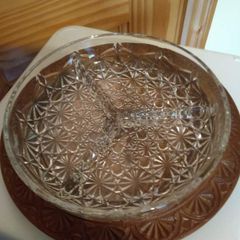 Nut dish in the holder is plastic have wood finished.