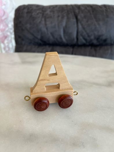 Letters, toys. Name Mia