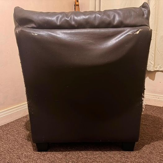 black leather sofa and arm chairs