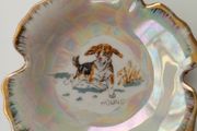 Small porcelain lustre trinket plate depicting Hound with sign Foreign at the back  D 9.5cm