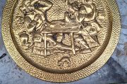 Large Brass Wall Charger Old World Pub Scene, Embossed Tavern scene of 17th-century Pubs. This is a striking brass wall hanging, with an Old World pub scene. It is pressed hammered brass. The raised relief image features a pair of men in Old World dress, 