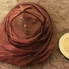 leather face brooch