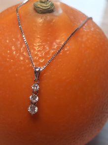 Three diamond pendant and 9ct white gold chain, D18 free reg post
