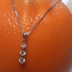 Three diamond pendant and 9ct white gold chain, D18 free reg post