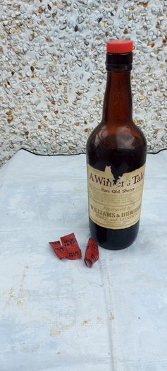 vintage bottle of winters tale sherry 3/4 full ,found in a old pub closed down,