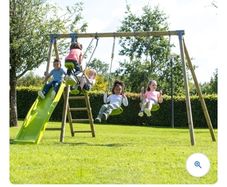 Wooden swings and slide set