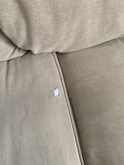 Corner sofa with footstool