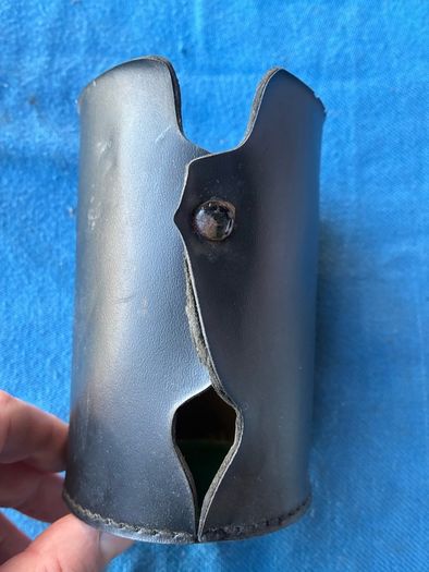 Vintage pint glass in leather holder