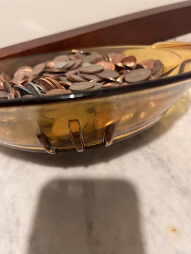 Beautiful vase full of old coins