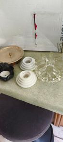 4 Candle holders Items Brass 5 1/2in Candle Holder Solid Brass Decent Condition 22.00 euro, vintage Bel Mondo glass pot warmer or candle holder designed with a textured, ice finish 25.00 euro. set of 2 white marble candle holder 22.00 E. Thai tea light ho