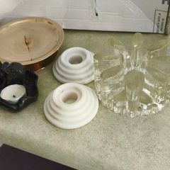 4 Candle holders Items Brass 5 1/2in Candle Holder Solid Brass Decent Condition 22.00 euro, vintage Bel Mondo glass pot warmer or candle holder designed with a textured, ice finish 25.00 euro. set of 2 white marble candle holder 22.00 E. Thai tea light ho