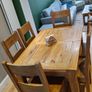 Solid wood oak extending dining table with matching chairs Image 7