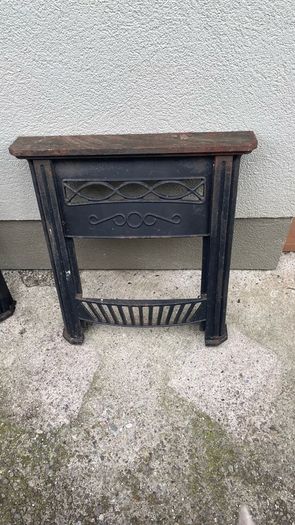 Two cast iron fire surrounds