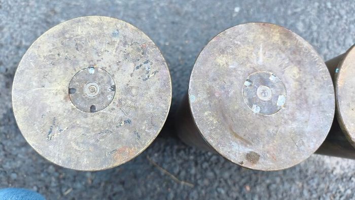 four empty brassartillery shell casings