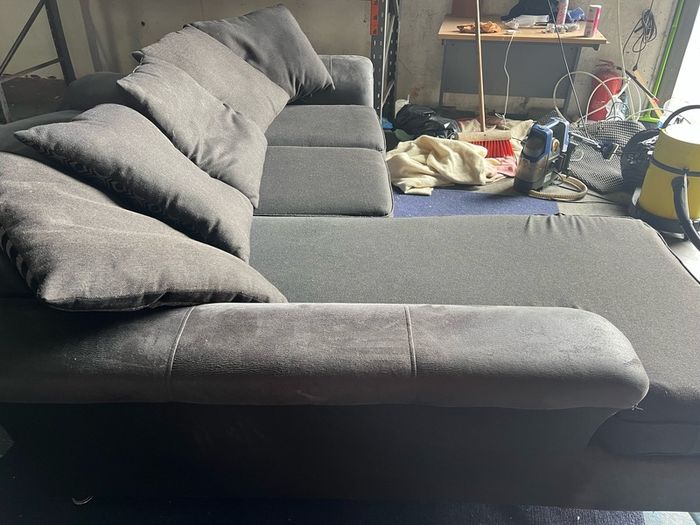 grey/black corner sofa with scatter cushions